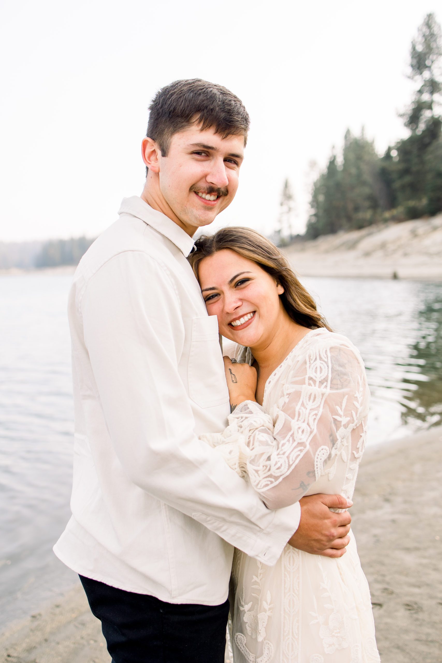 Bride and groom smile together during their portraits